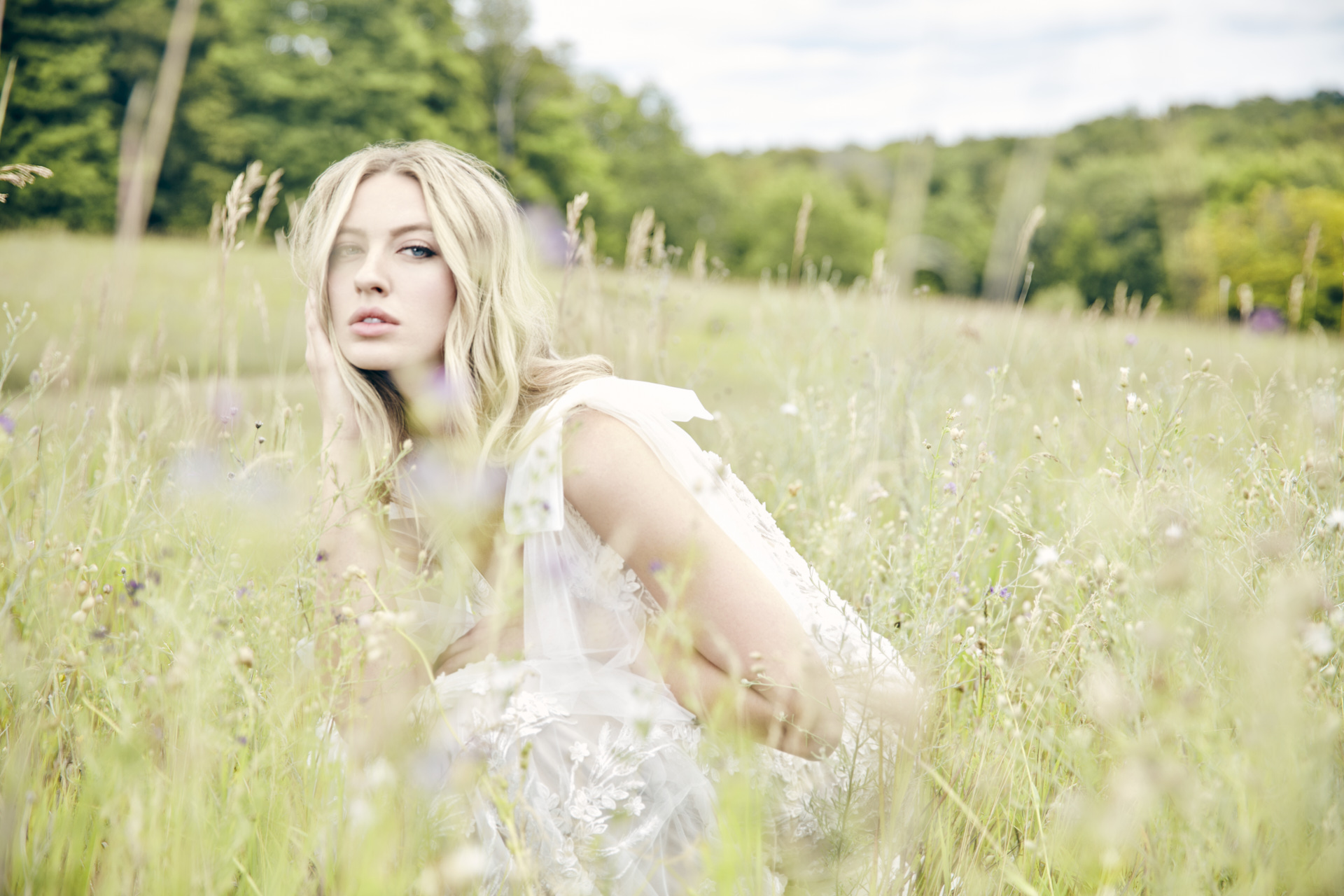 Lians' bridal editorial Hair & Makeup by Monica Jadan: a sun-kissed bride in a ruffled gown at Lavender Hills Farm, Michigan.