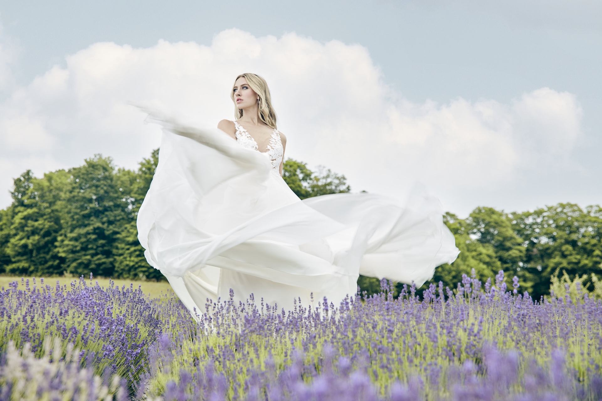 Lians' bridal editorial Hair & Makeup by Monica Jadan: a sun-kissed bride in a ruffled gown at Lavender Hills Farm, Michigan.