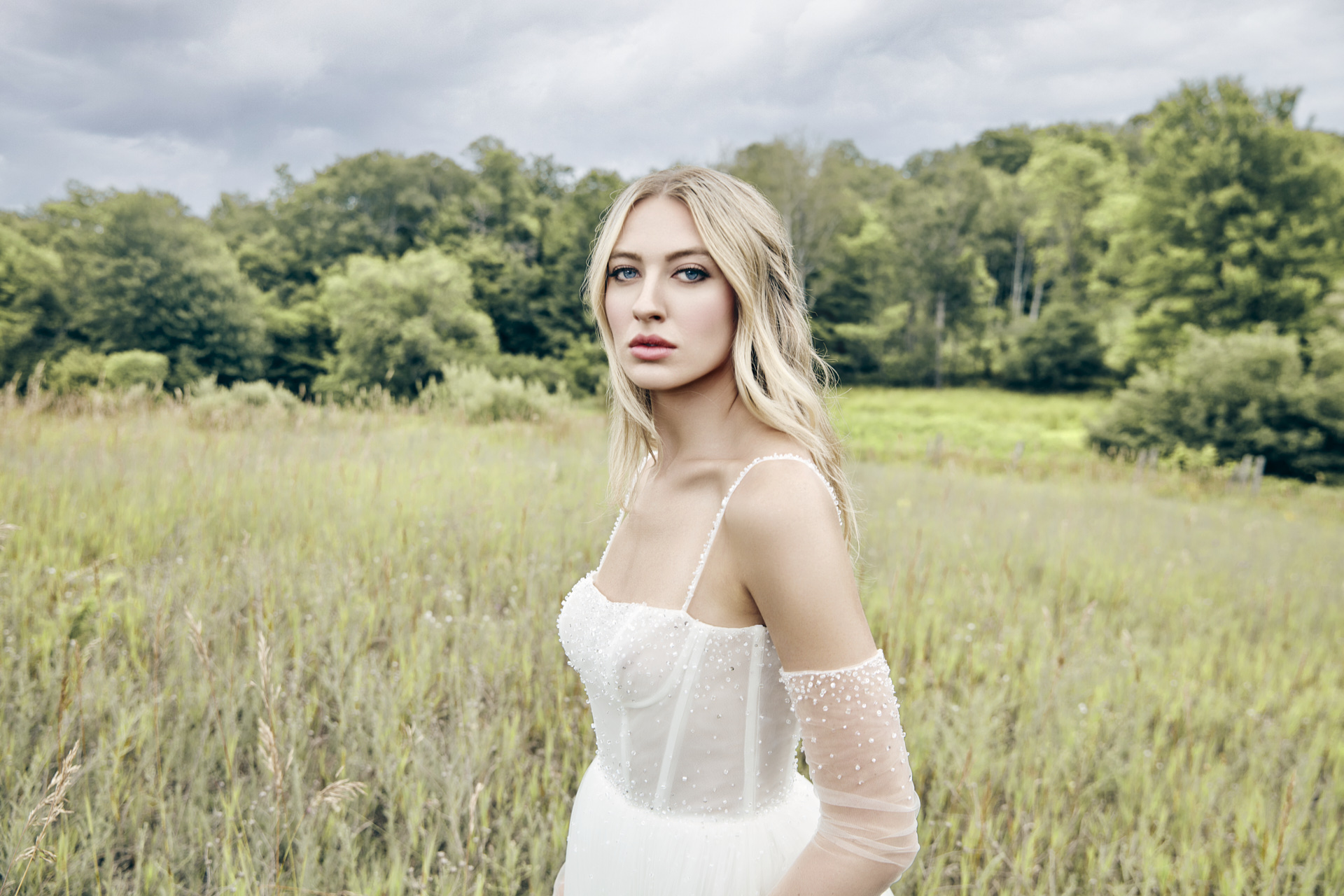 Lians' bridal editorial Hair & Makeup by Monica Jadan: a sun-kissed bride in a ruffled gown at Lavender Hills Farm, Michigan.