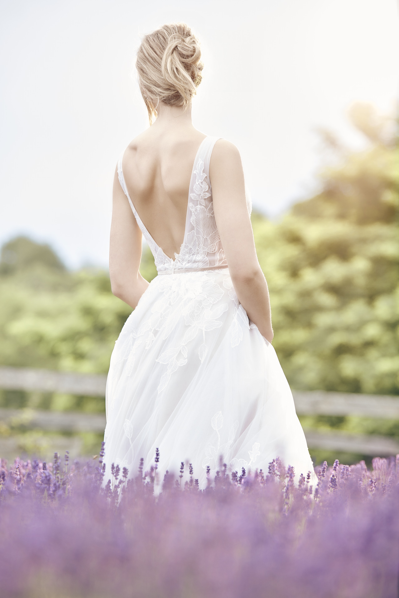 Lians' bridal editorial Hair & Makeup by Monica Jadan: a sun-kissed bride in a ruffled gown at Lavender Hills Farm, Michigan.